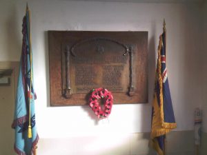 Poppy wreath and war memorial
